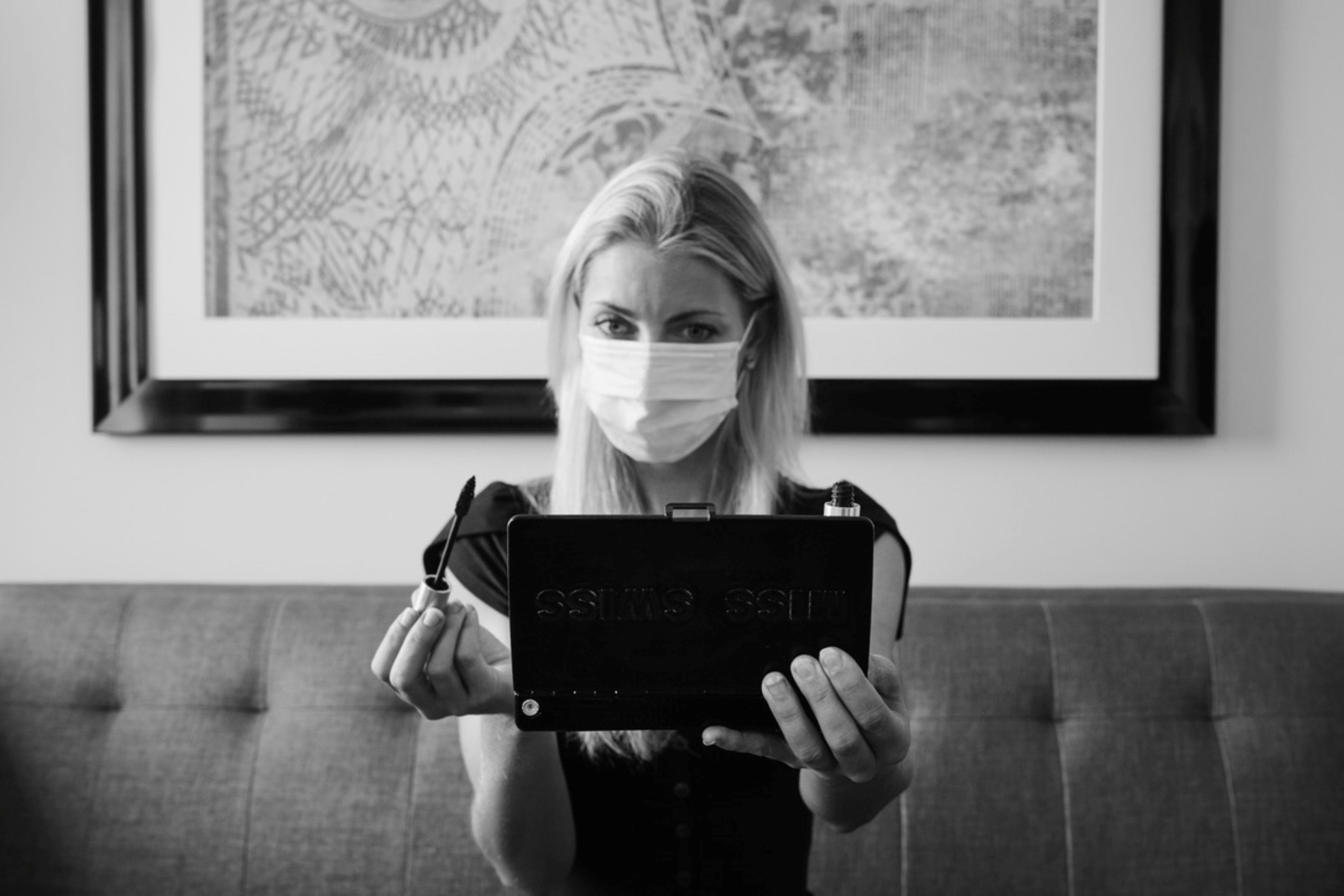 woman in black shirt holding black tablet computer